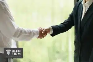 Lawyer shaking hand with client